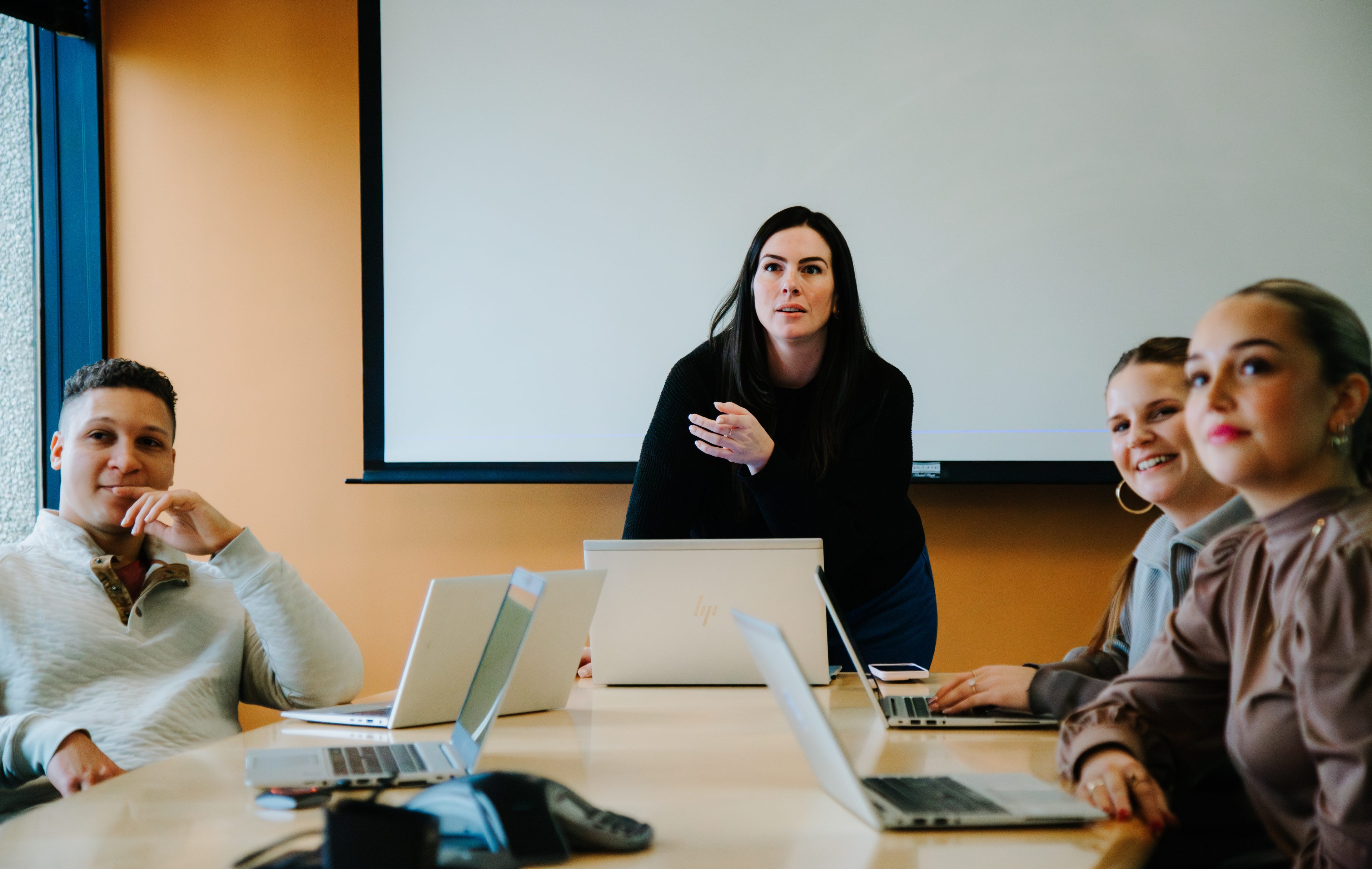 Businesswoman leading a meeting with her team